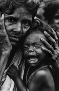 Exhausted mother and child, in a camp on the border of India and Bangladesh, August 1971